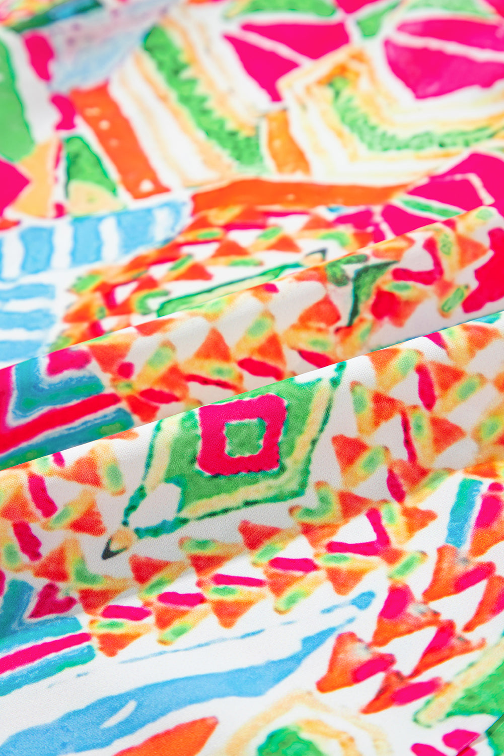 Oranje overhemdjurk met contrasterende geometrische print en korte mouwen