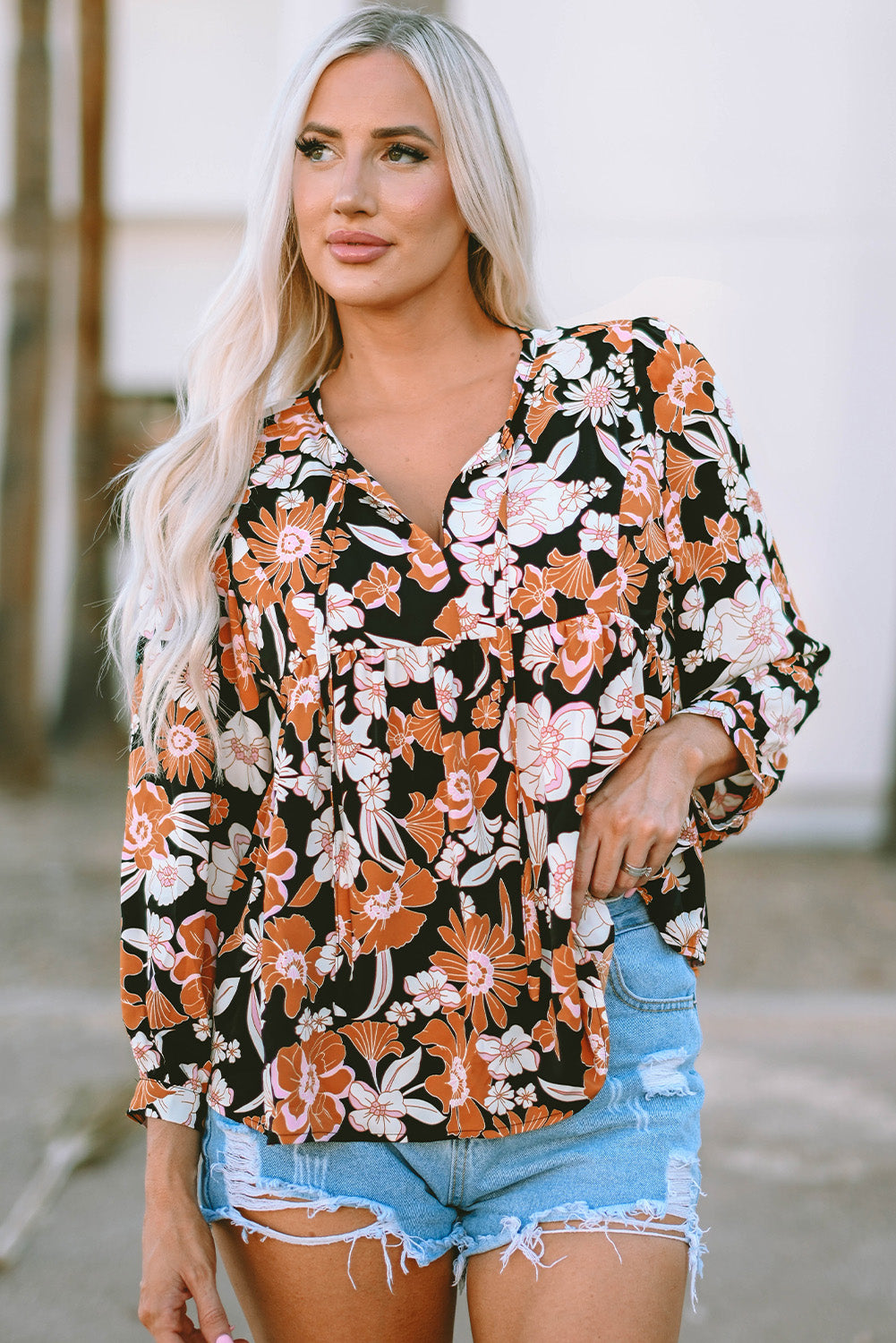 Bruine babydollblouse met 3/4 mouwen en bloemenprint