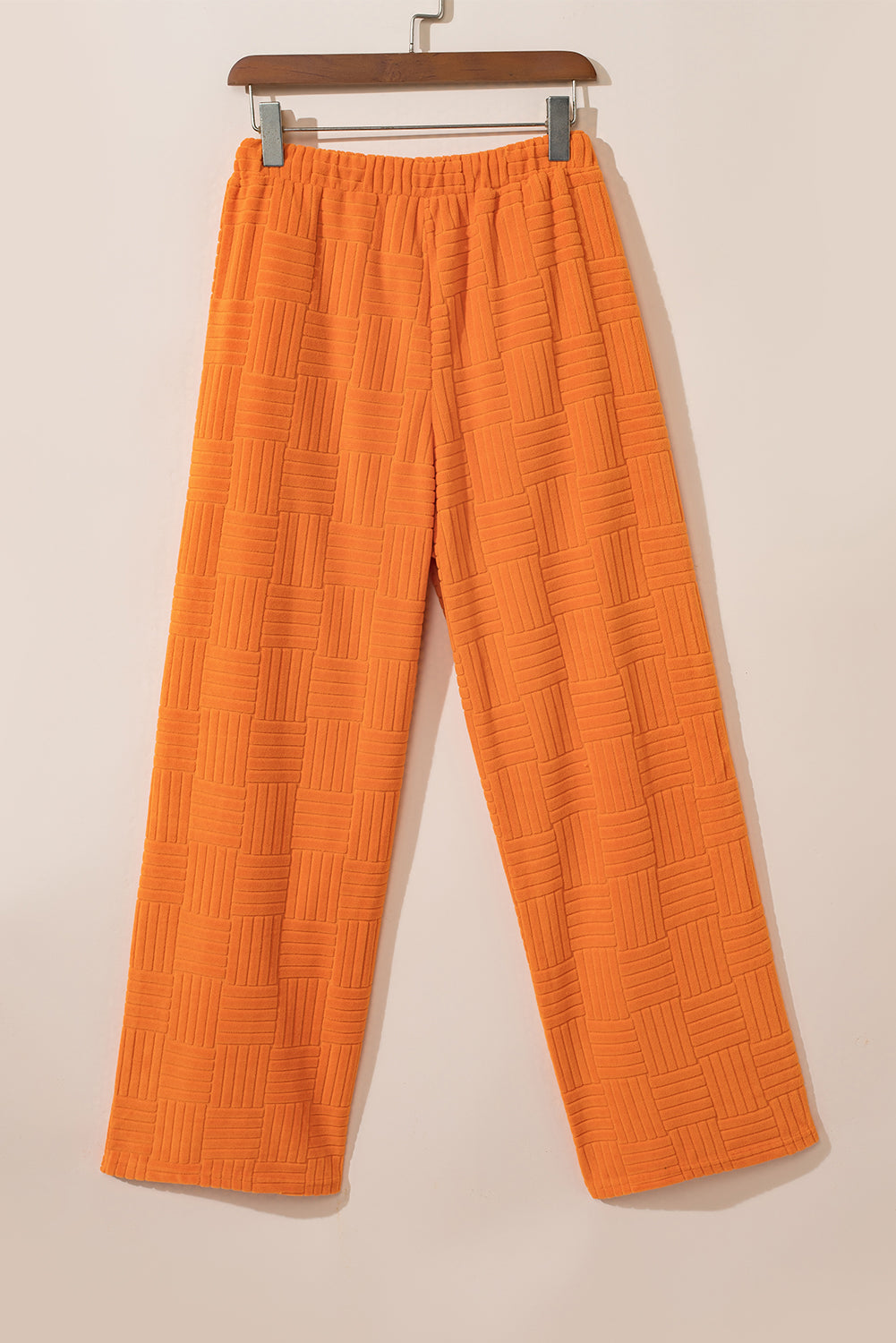 Oranje getextureerde tanktop en broek met wijde pijpen