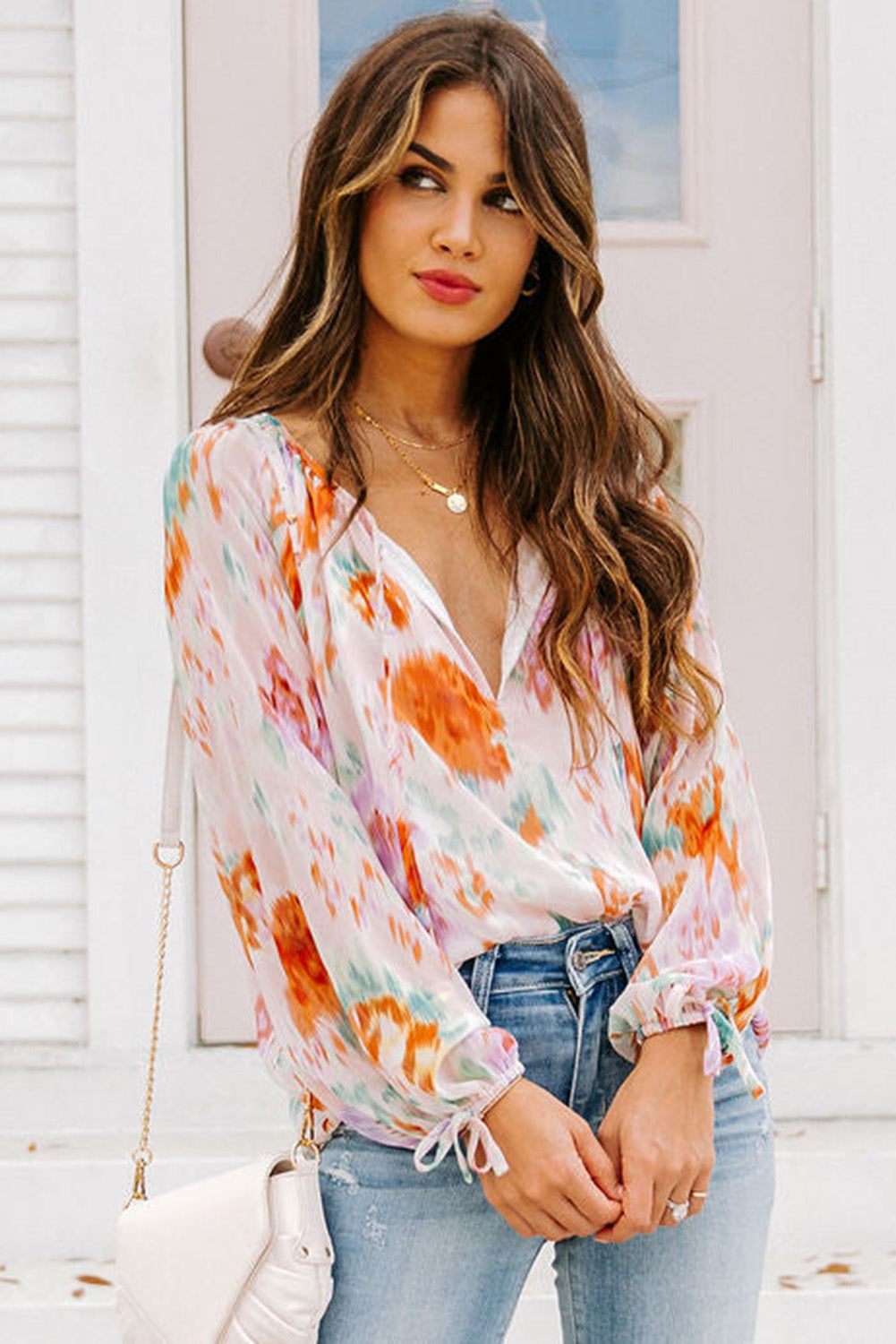 Blouse met veelkleurige abstracte print en splithals en pofmouwen