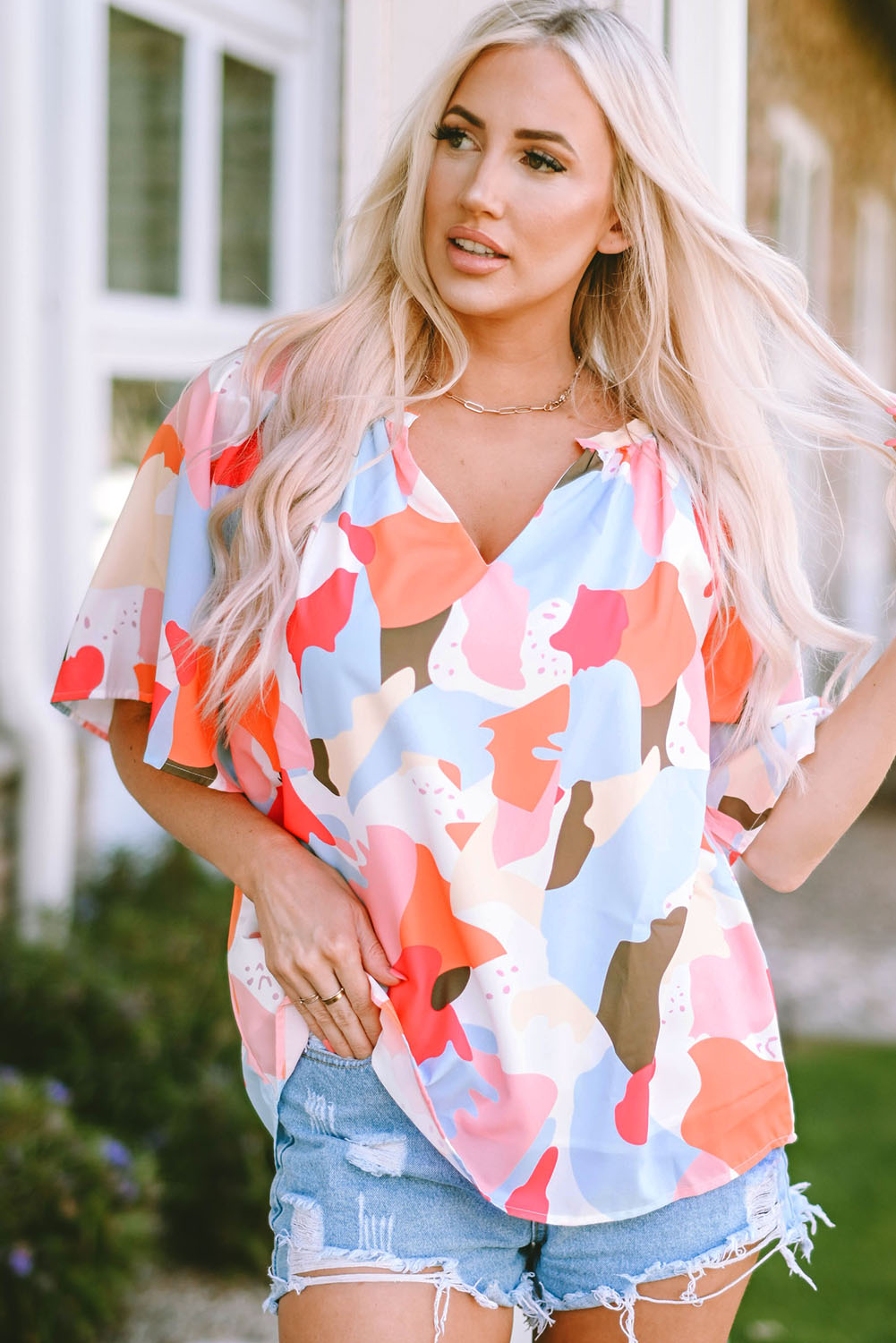 Blouse met veelkleurige bloemenprint, V-hals en halve mouw