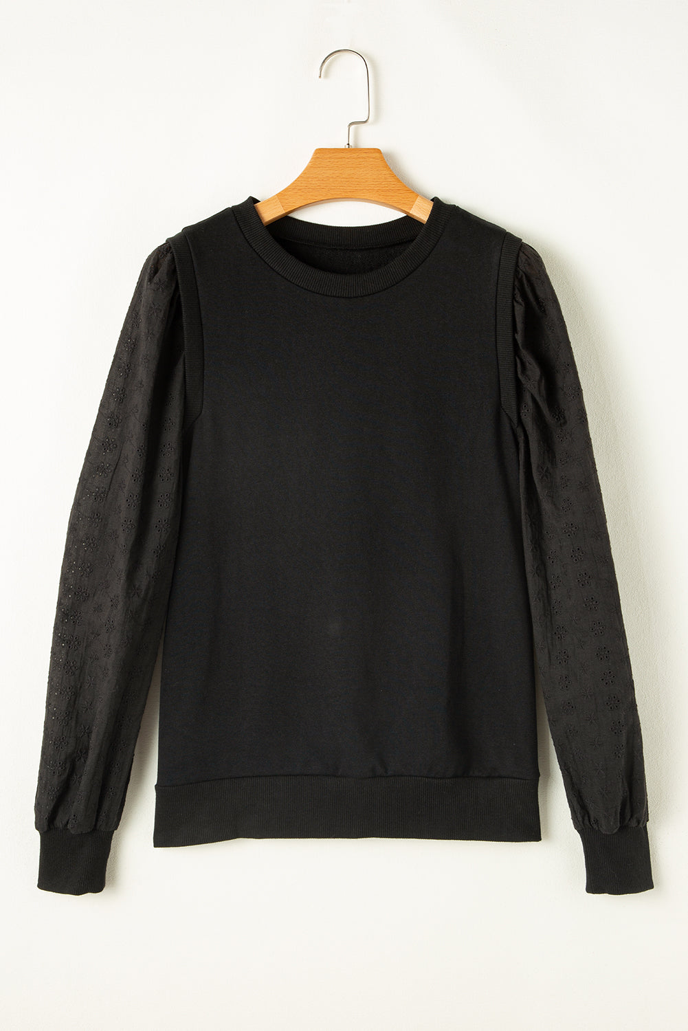 Zwart getextureerd sweatshirt met ronde hals en patchwork
