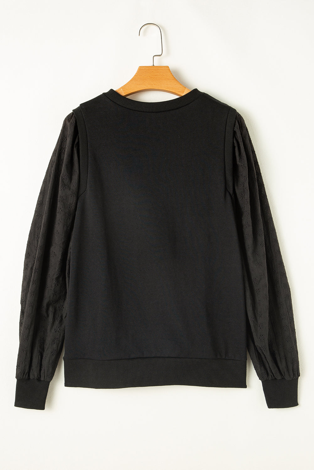Zwart getextureerd sweatshirt met ronde hals en patchwork