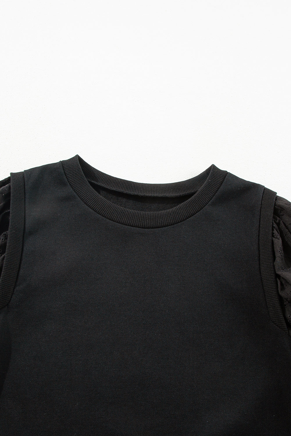 Zwart getextureerd sweatshirt met ronde hals en patchwork