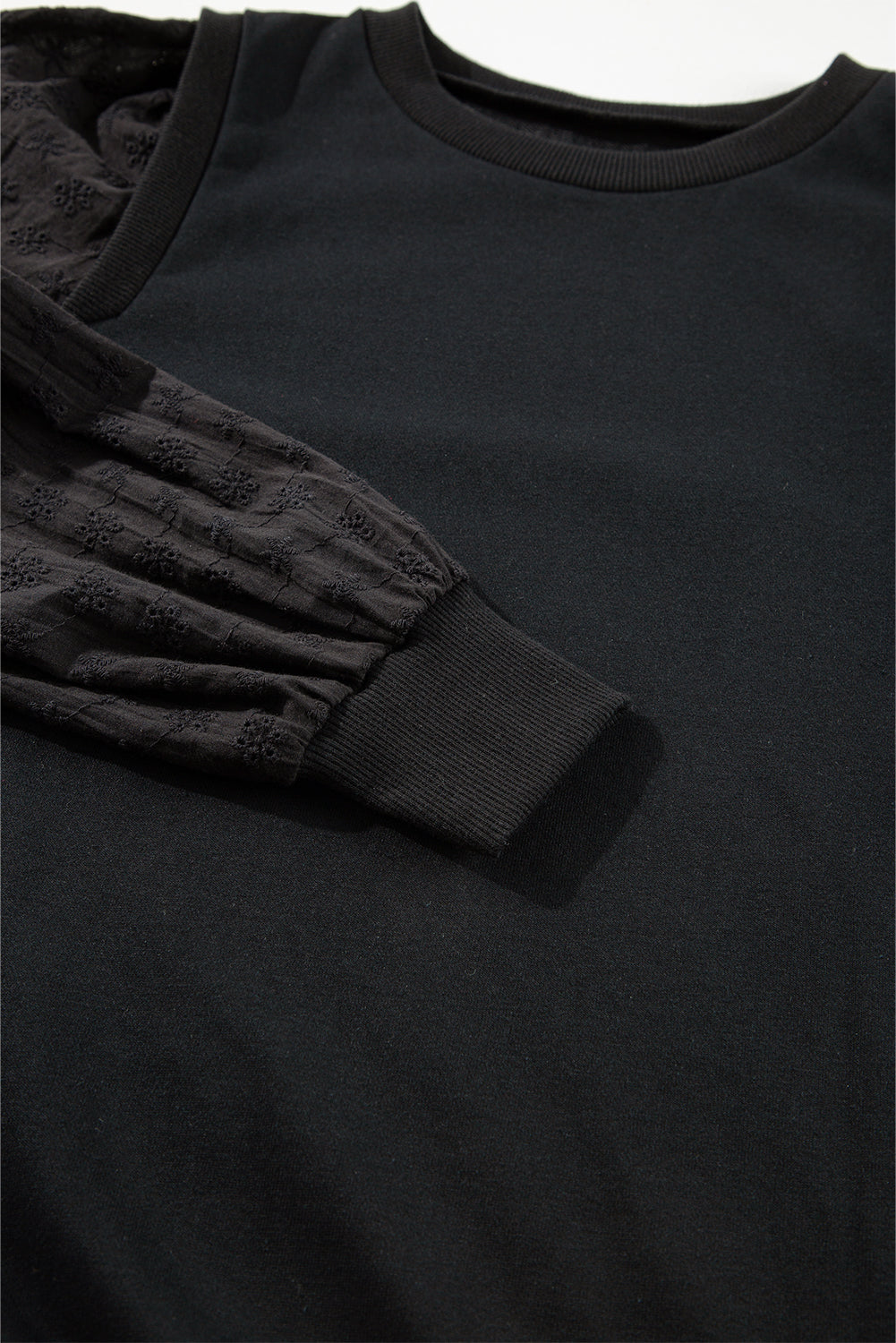 Zwart getextureerd sweatshirt met ronde hals en patchwork