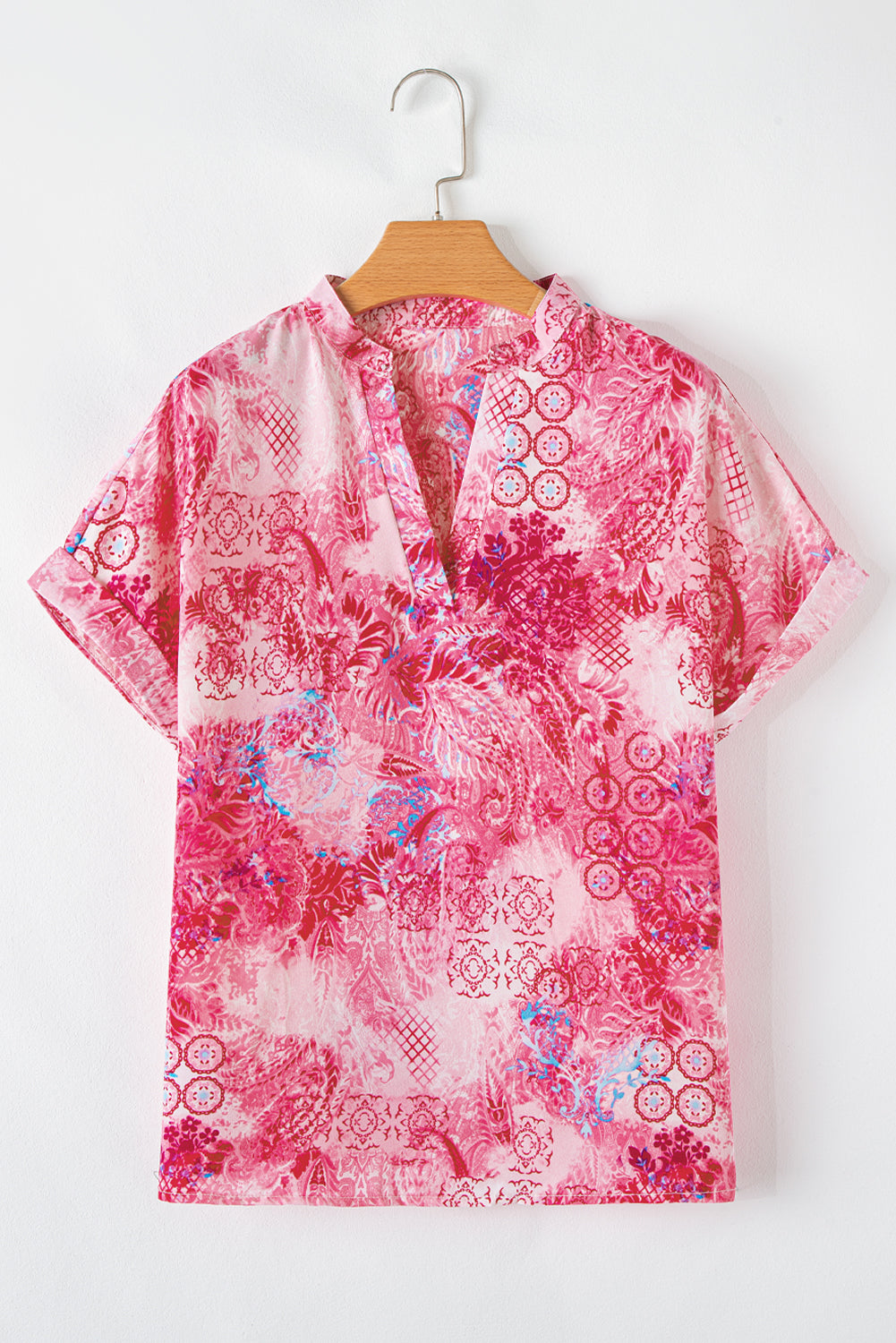 Roze abstracte bloemenprint Notch V-hals opgerolde blouse met korte mouwen