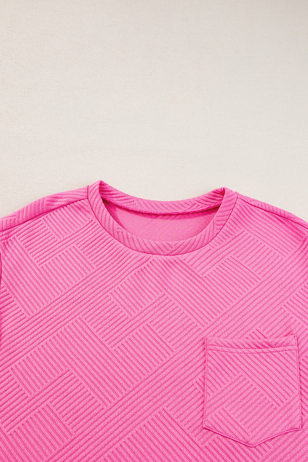 Sachet roze getextureerde T-shirtjurk met kapmouwen