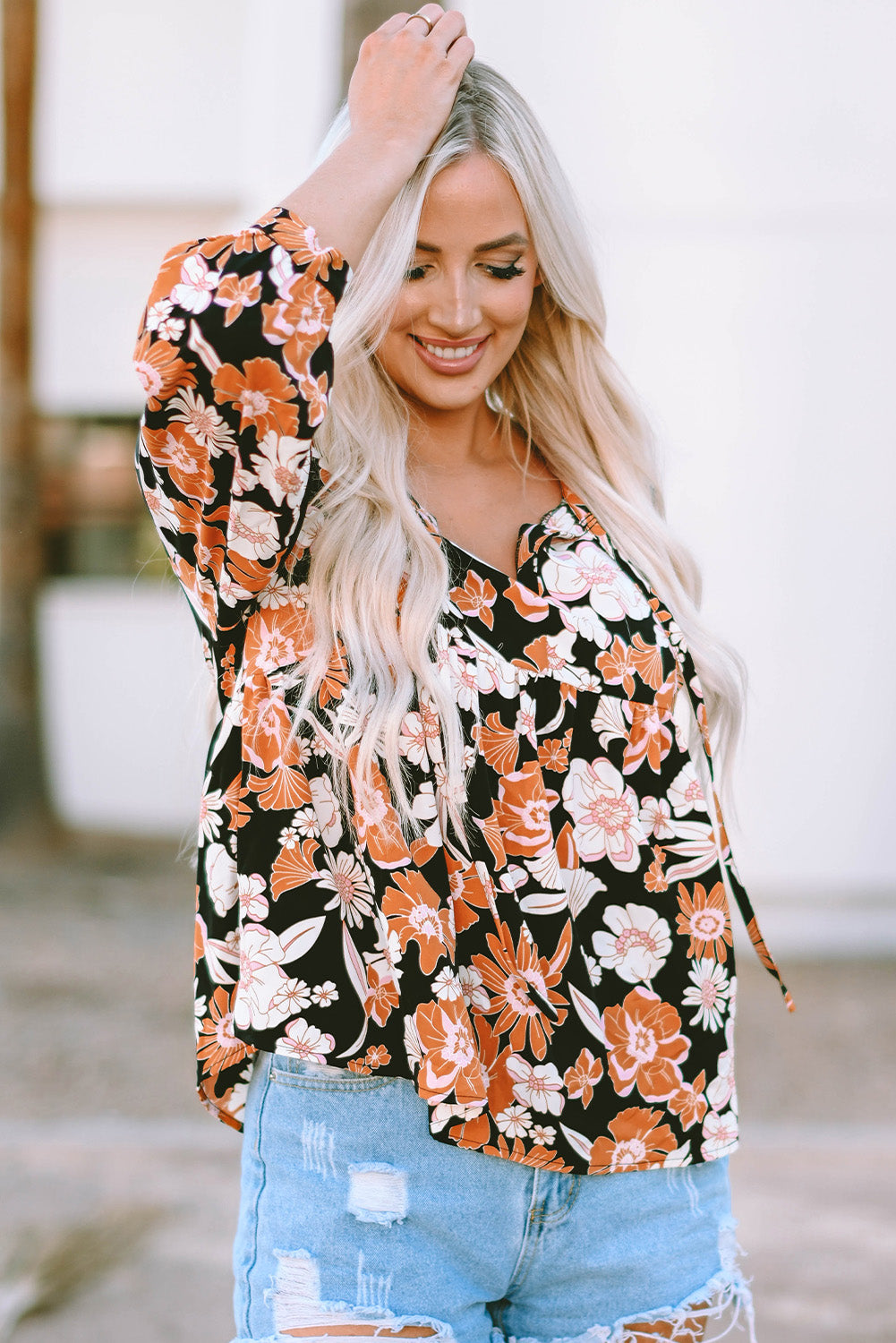 Bruine babydollblouse met 3/4 mouwen en bloemenprint