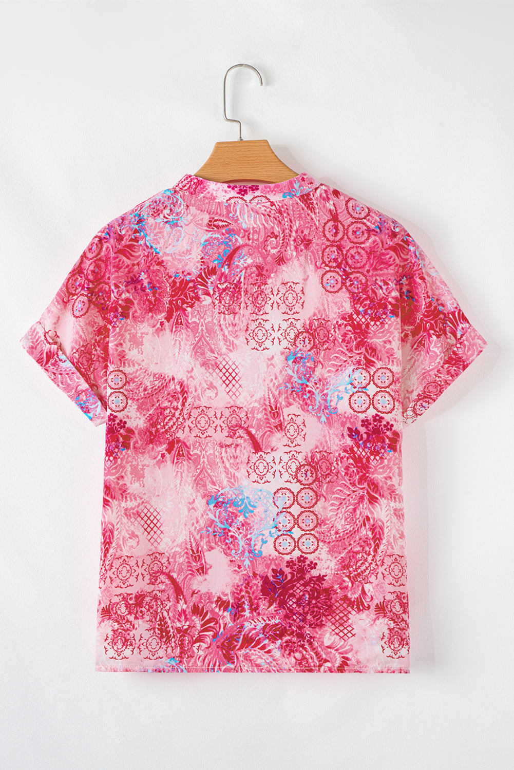 Roze abstracte bloemenprint Notch V-hals opgerolde blouse met korte mouwen