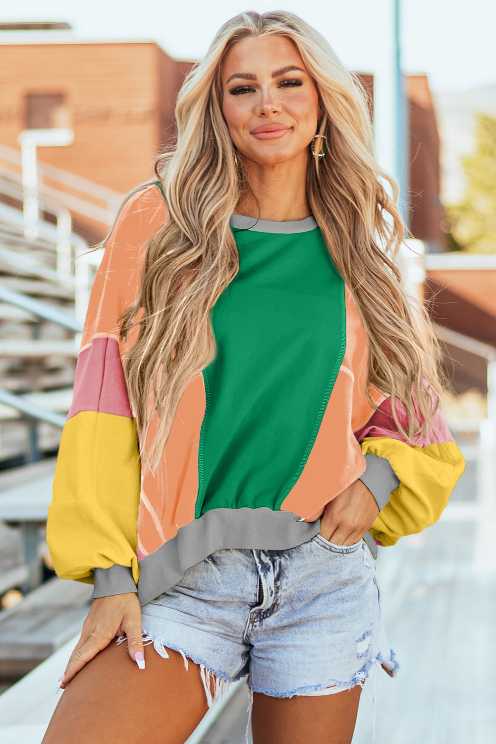 Donkergroene kleurblok patchwork blootgestelde stiksels oversized top