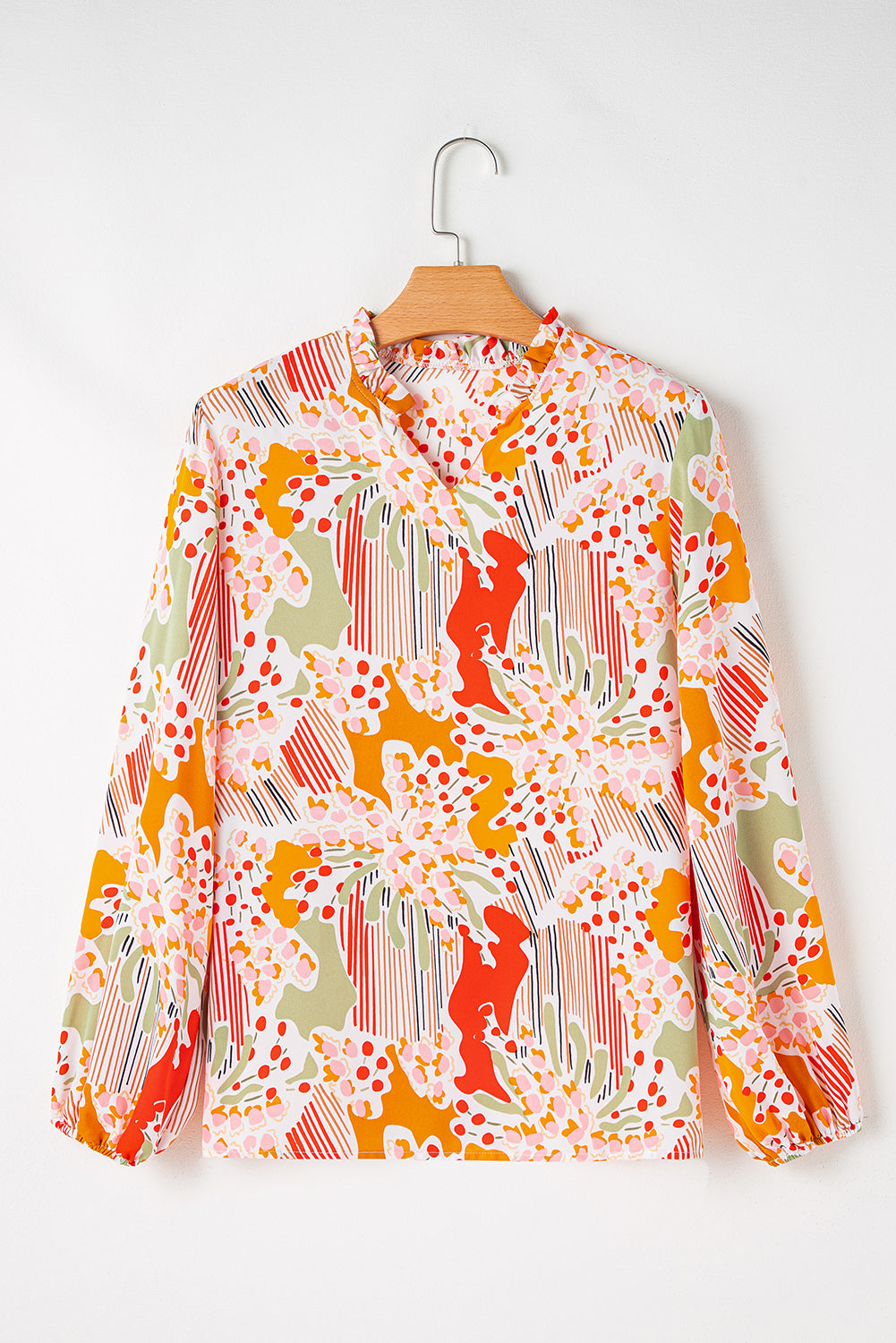 Oranje bedrukte blouse met V-hals en pofmouwen