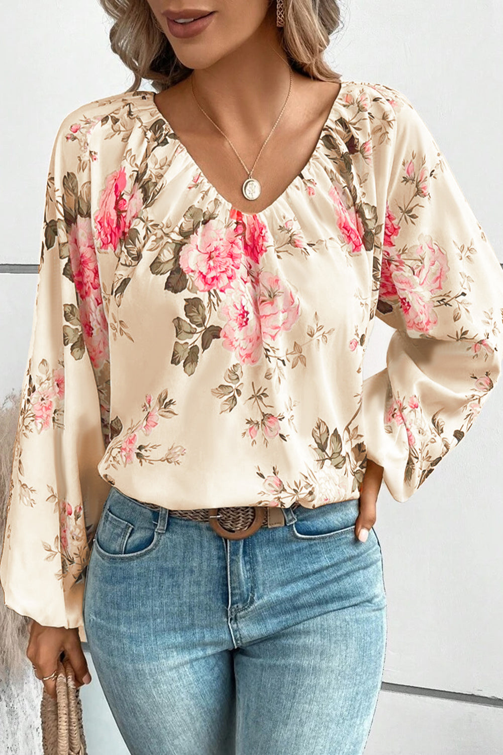 Beige blouse met V-hals met bloemenprint en lantaarnmouwen