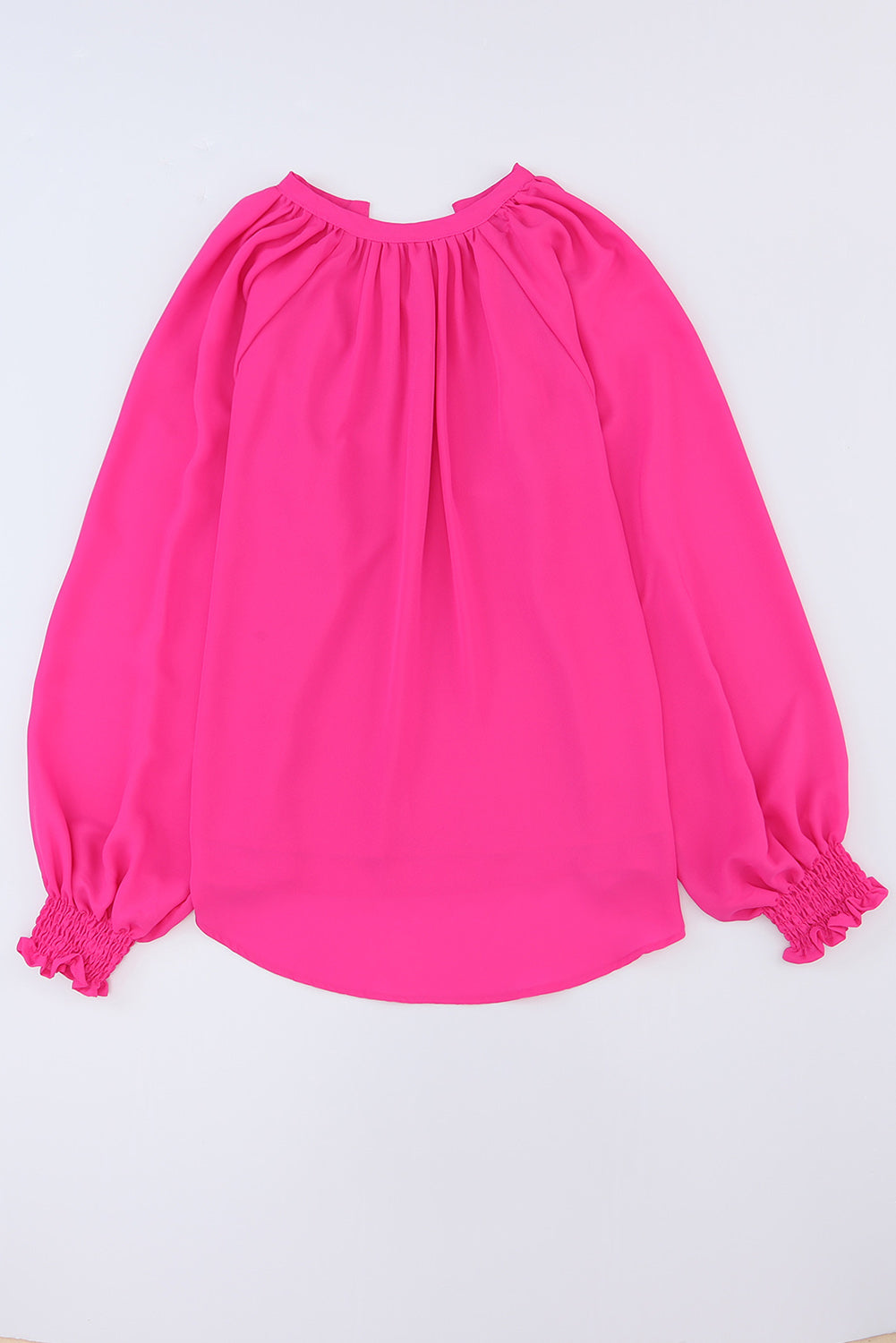 Roze geplooide blouse met V-hals en gezwollen mouwen