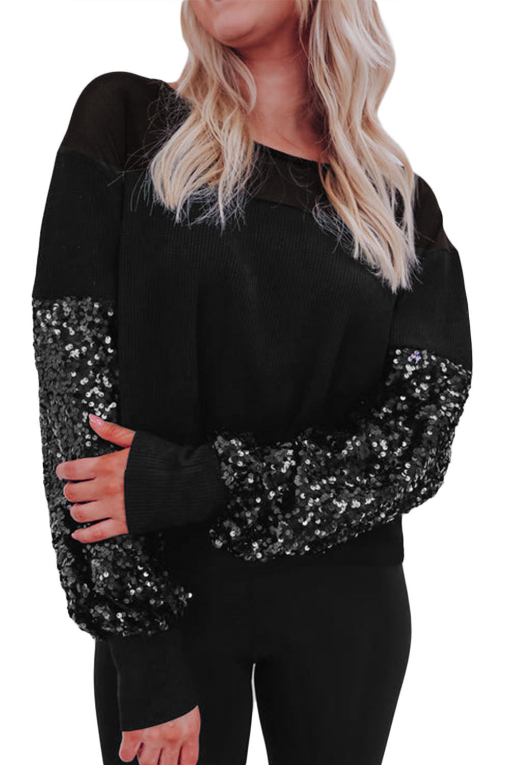Zwarte blouse met patchwork en lantaarnmouwen met pailletten