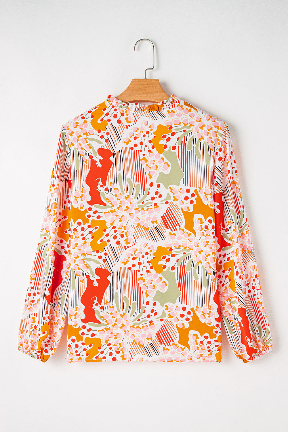 Oranje bedrukte blouse met V-hals en pofmouwen