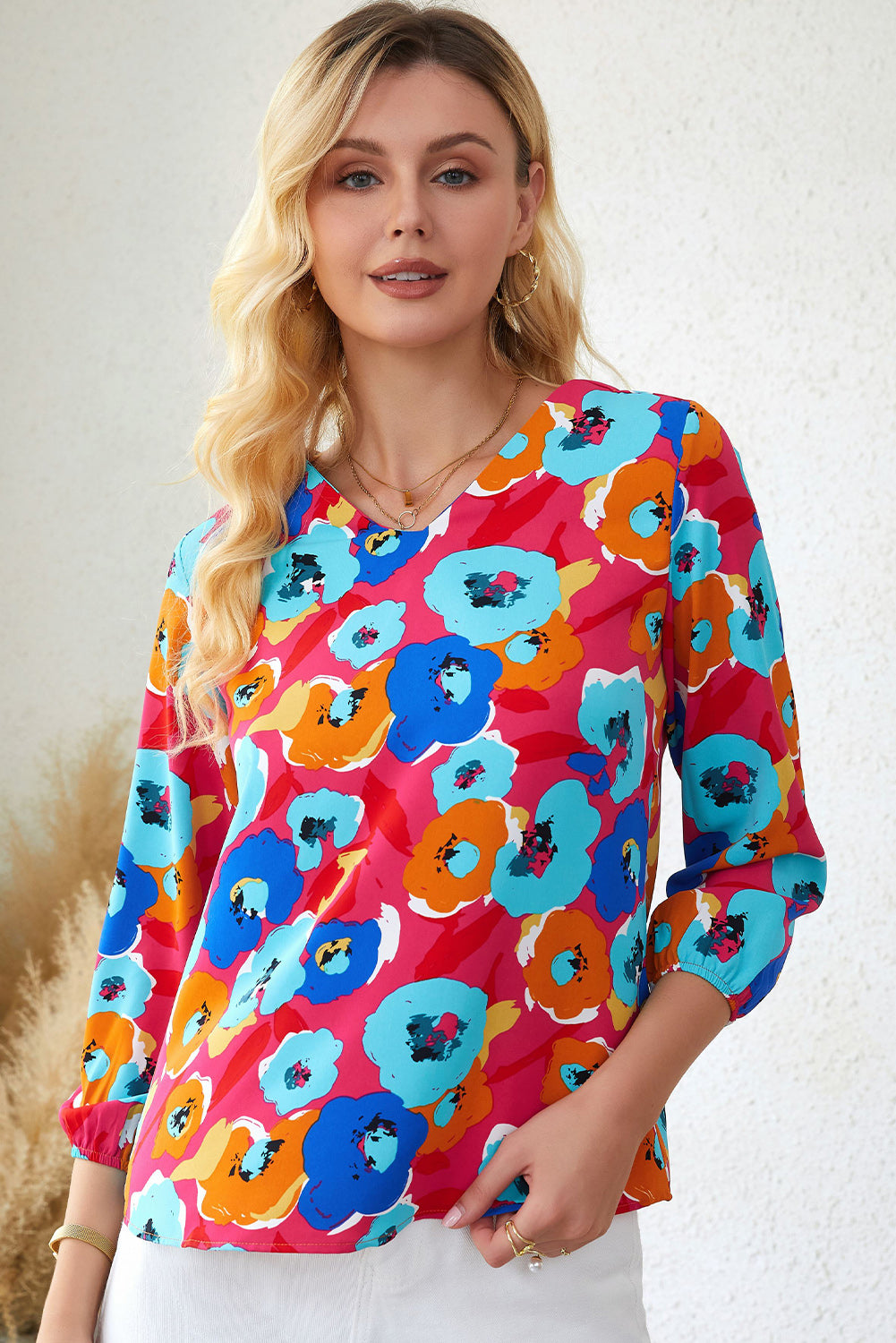 Roze veelkleurige blouse met V-hals en 3/4 mouwen met bloemenprint