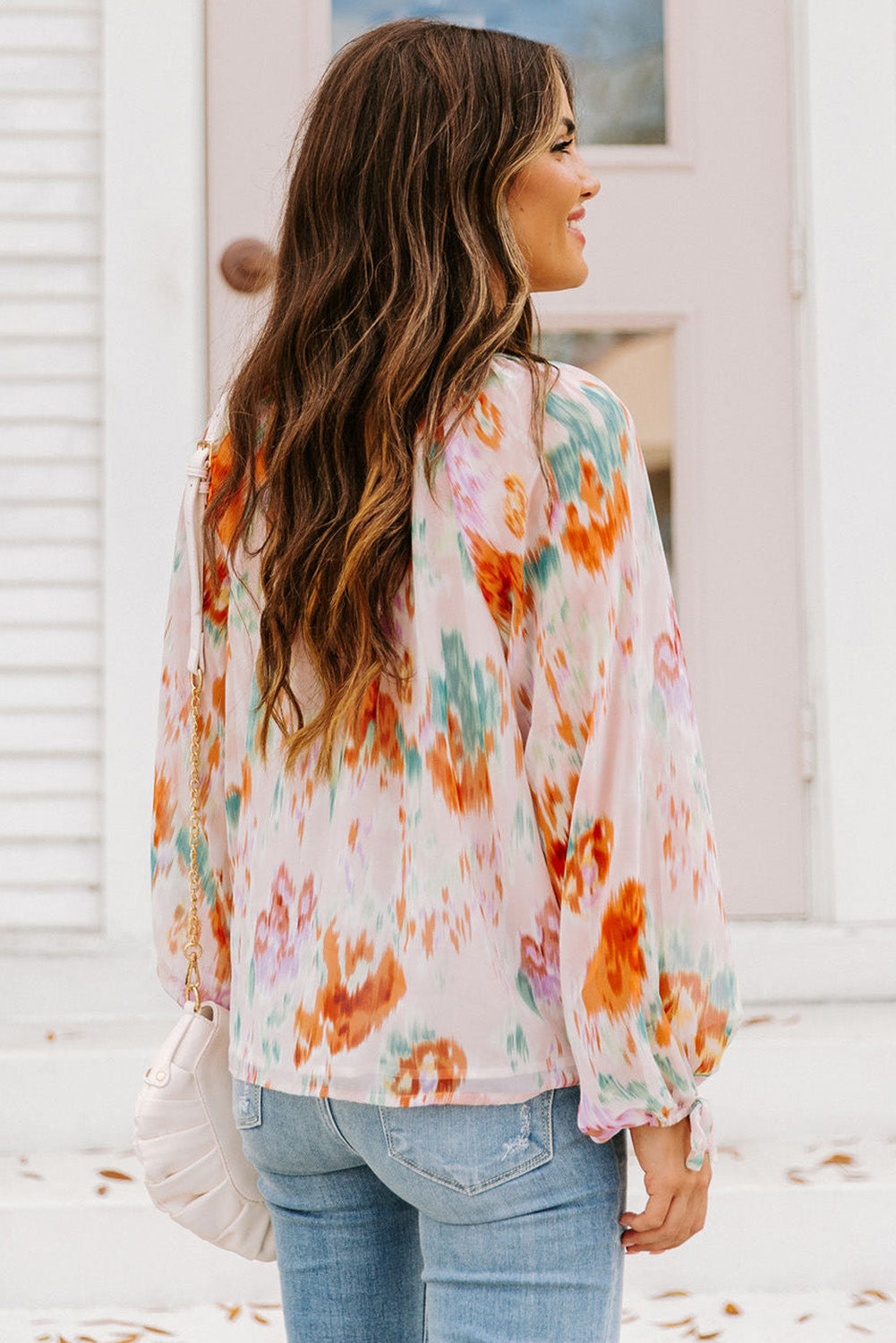 Blouse met veelkleurige abstracte print en splithals en pofmouwen