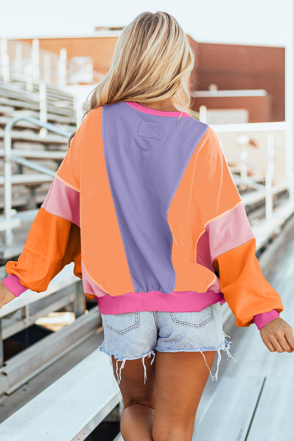 Donkergroene kleurblok patchwork blootgestelde stiksels oversized top