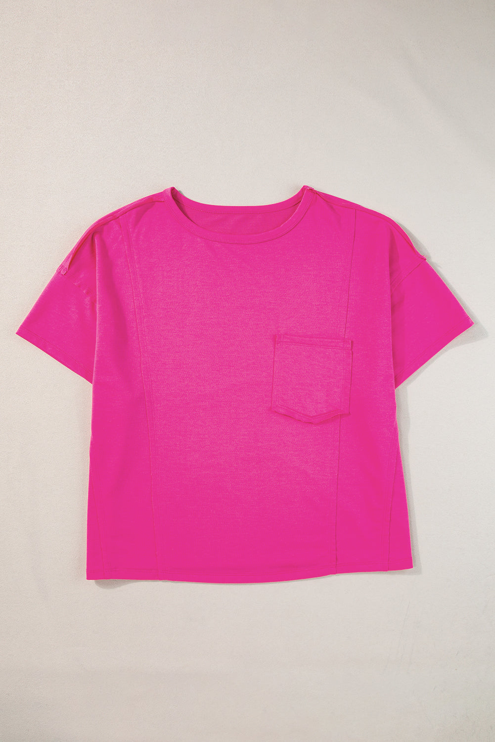 Felroze oversized T-shirt met opgestikte zak en zichtbare naad