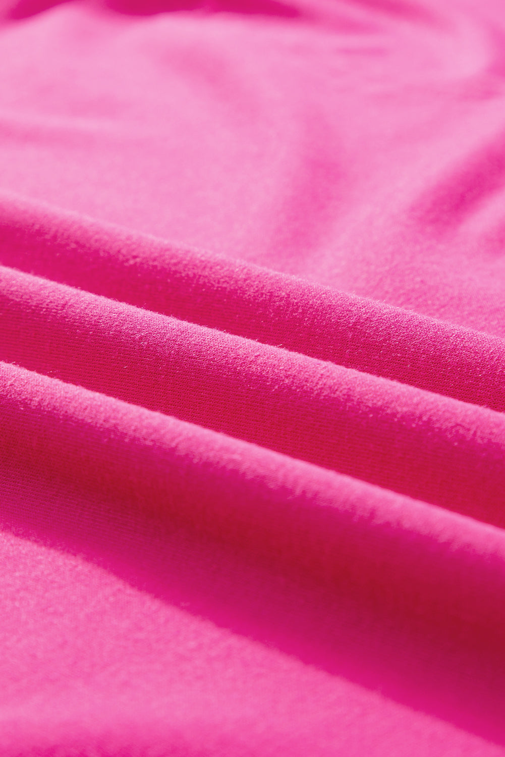 Felroze oversized T-shirt met opgestikte zak en zichtbare naad