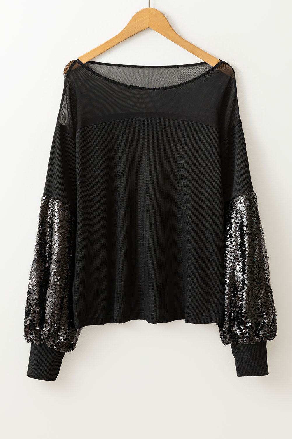 Zwarte blouse met patchwork en lantaarnmouwen met pailletten