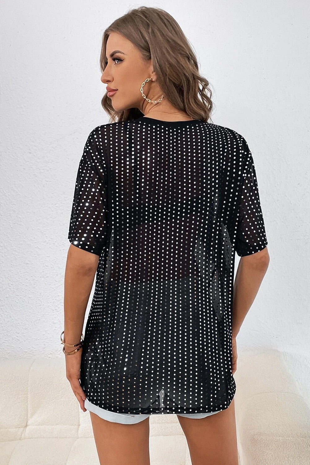 Zwart transparant T-shirt met lage schouder en pailletten