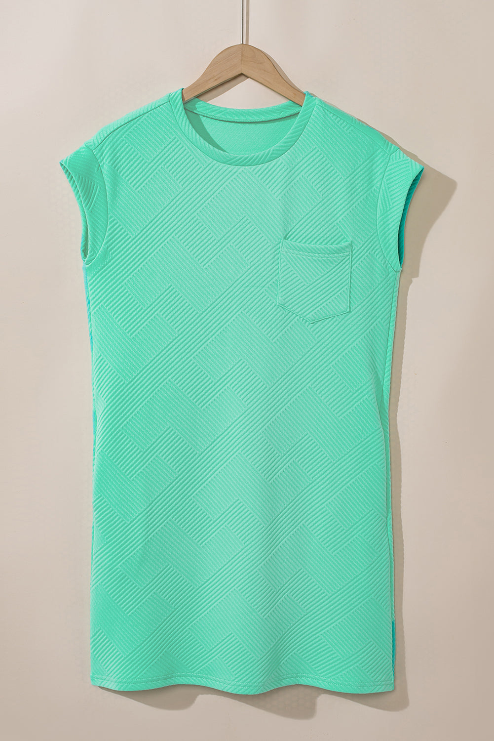 Mintgroene T-shirtjurk met getextureerde kapmouw