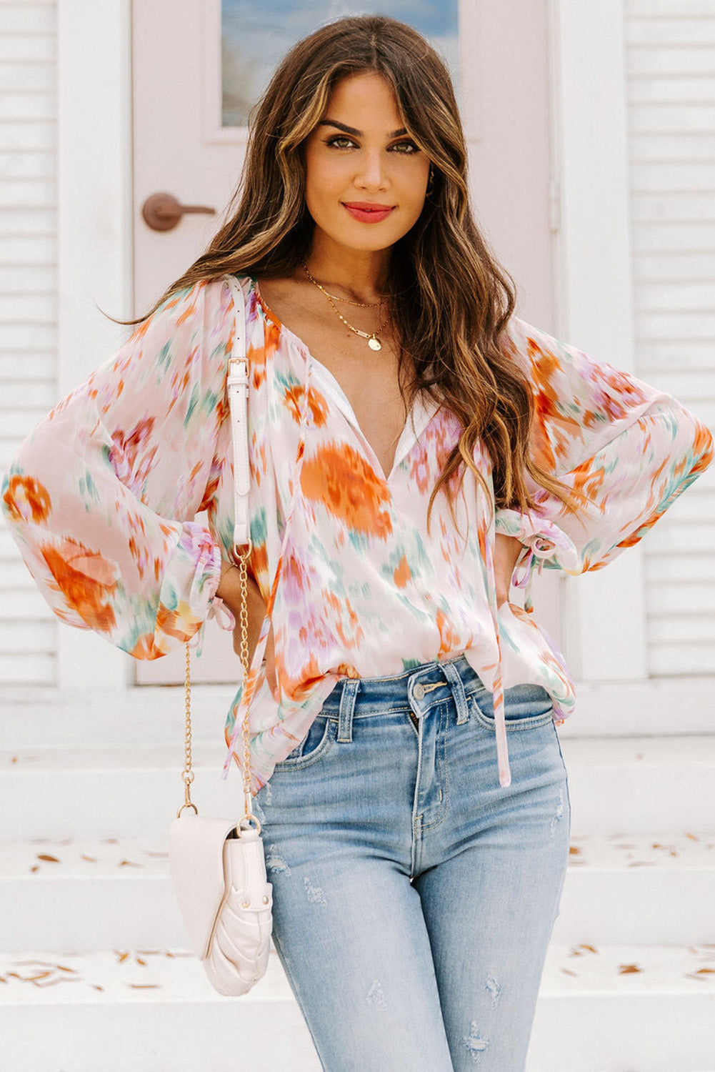 Blouse met veelkleurige abstracte print en splithals en pofmouwen