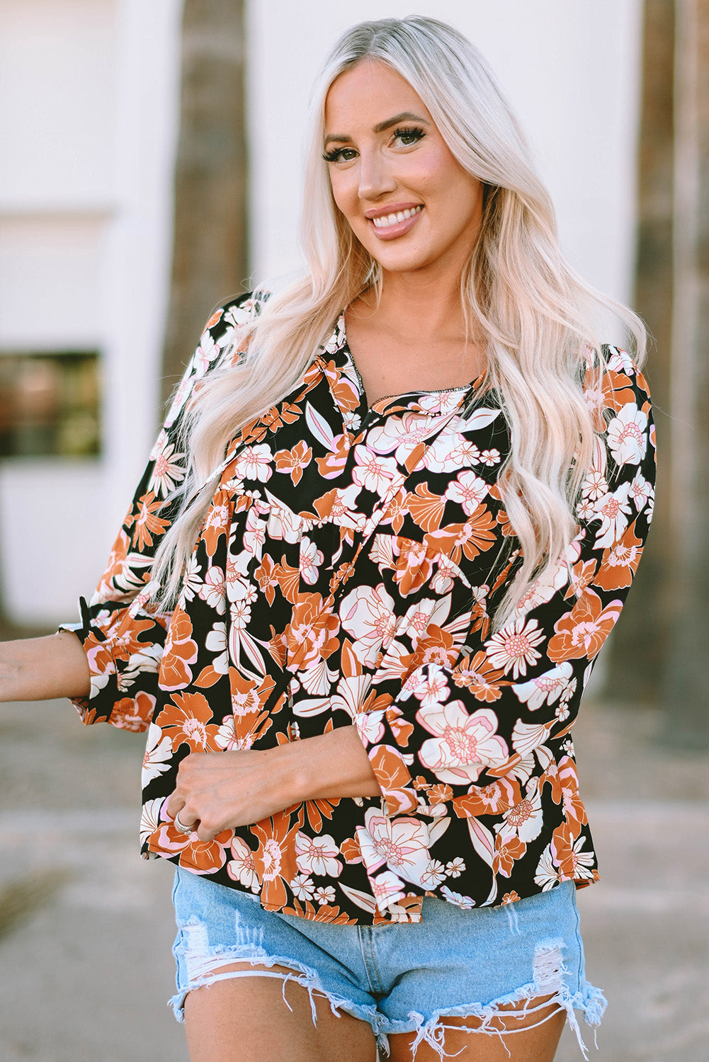 Bruine babydollblouse met 3/4 mouwen en bloemenprint