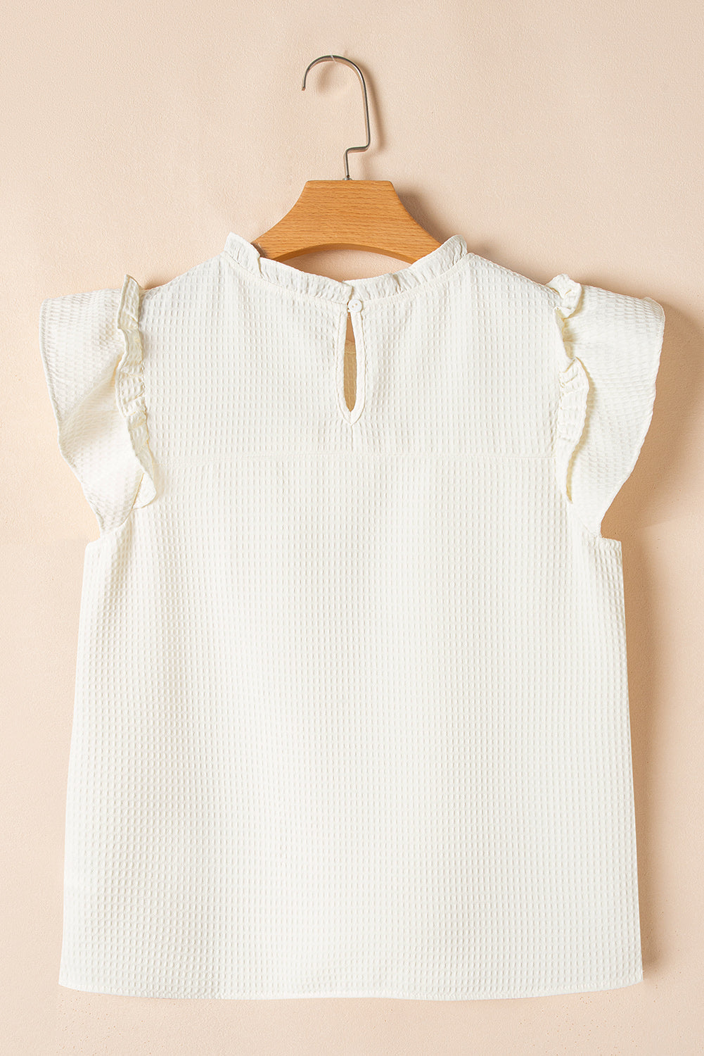 Witte vaste kleur ruches trim wafel gebreide blouse