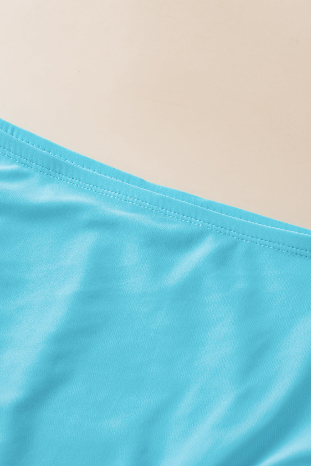 Turkoois gestreept tankini-badpak met geknoopte zoom