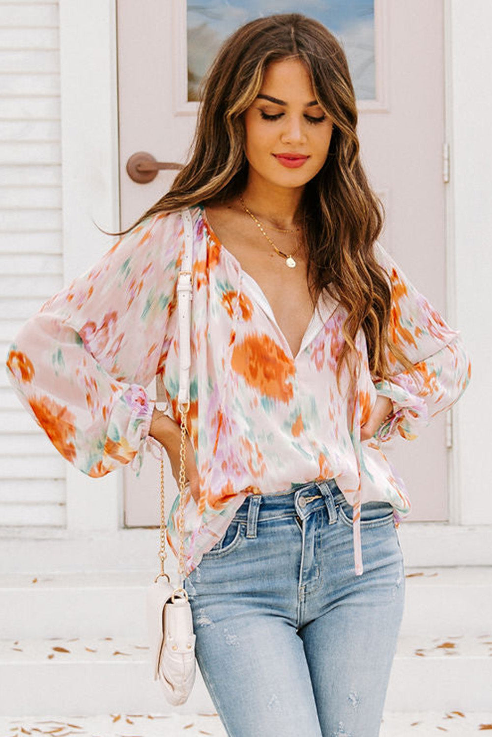 Blouse met veelkleurige abstracte print en splithals en pofmouwen