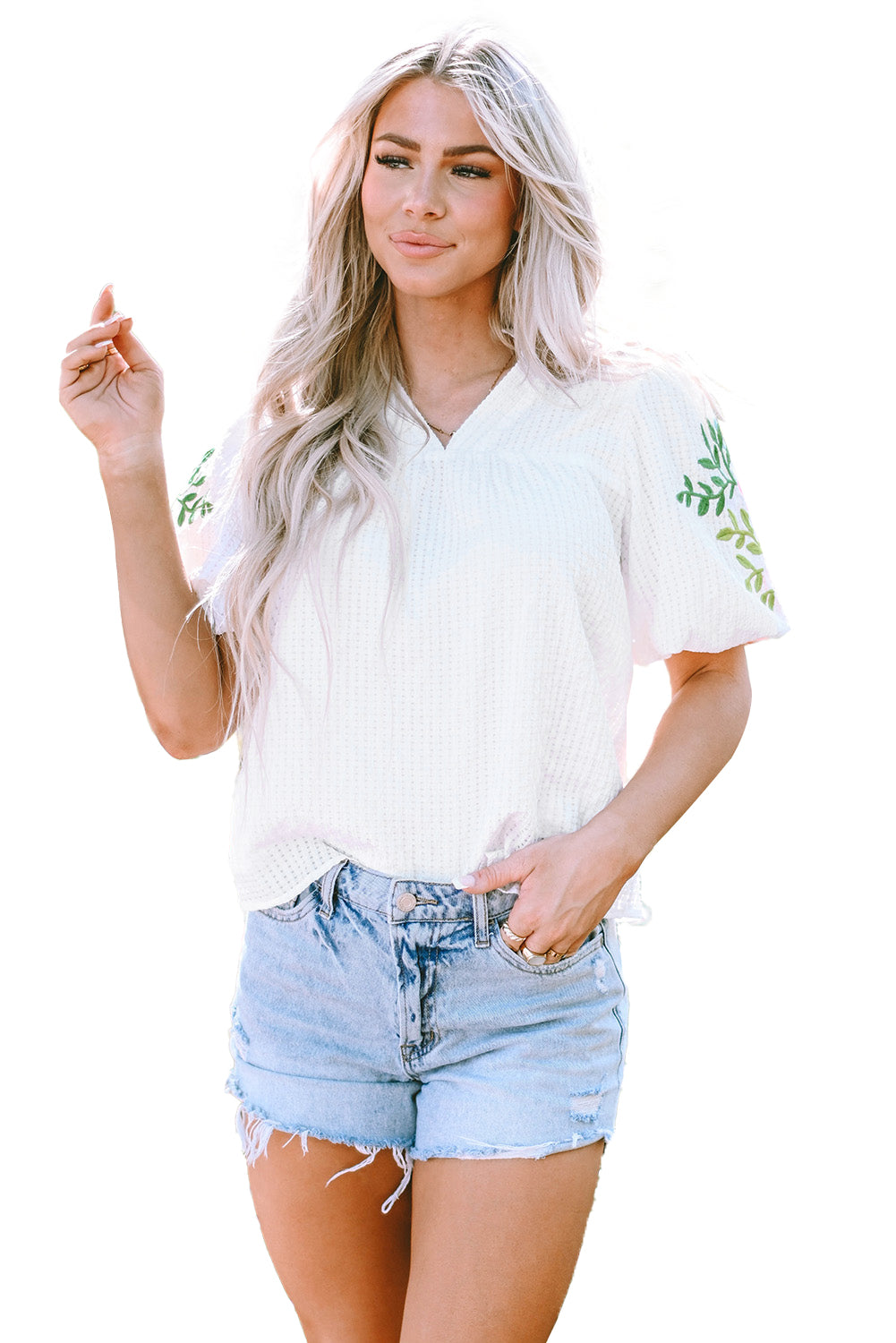 Witte bloemen geborduurde blouse met pofmouwen en ingekeepte hals