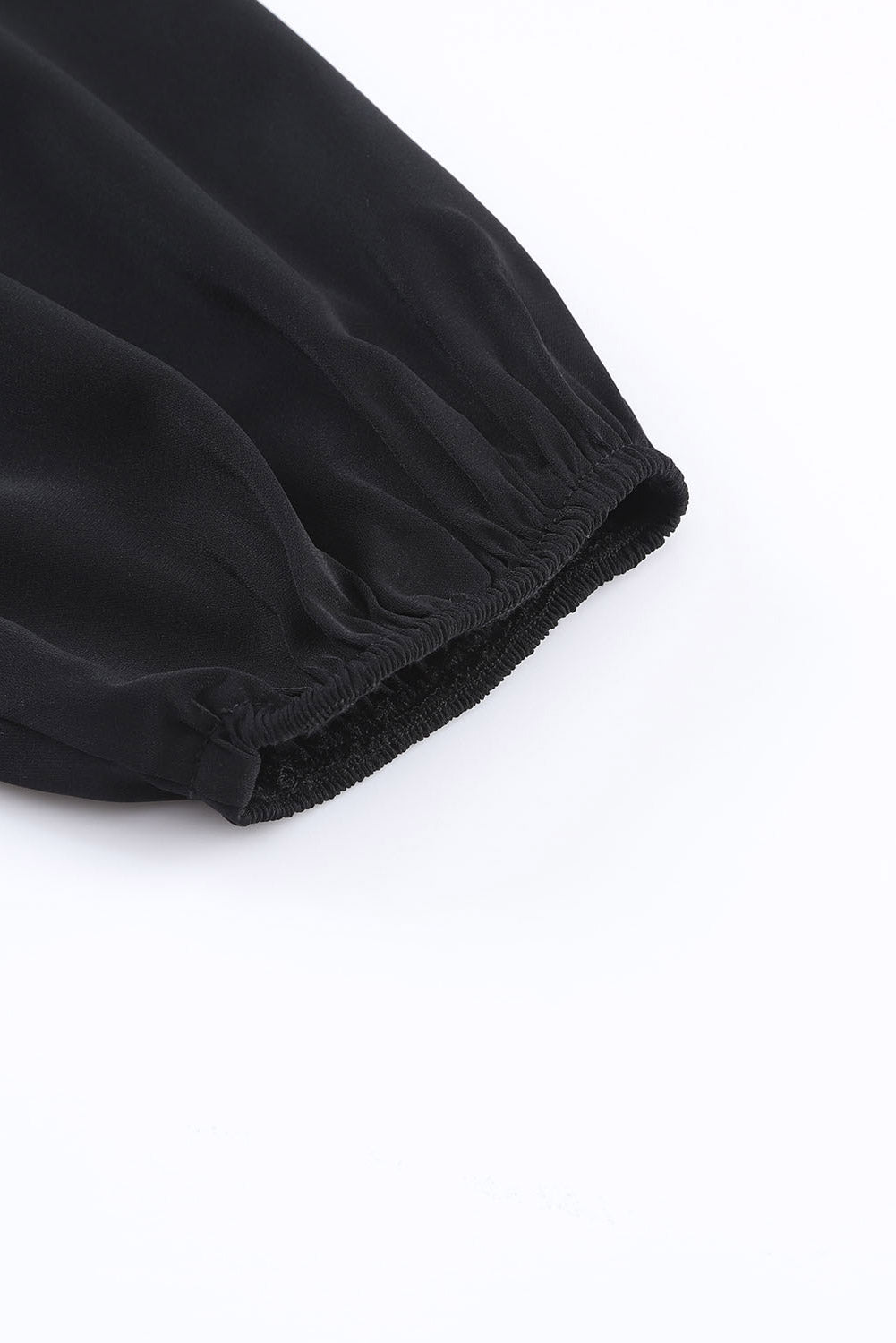Zwart geknoopte asymmetrische off-shoulder blouse