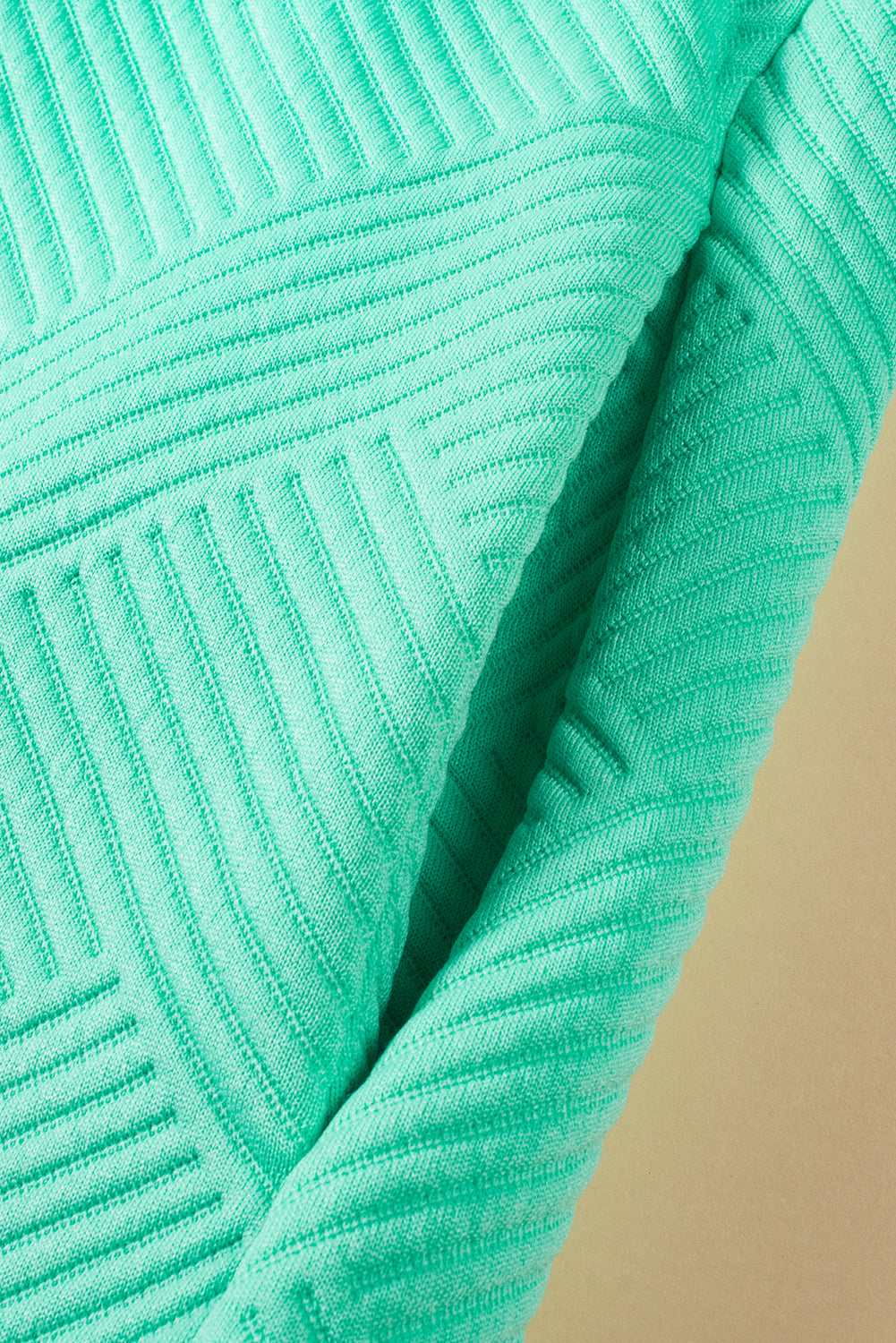 Mintgroene T-shirtjurk met getextureerde kapmouw