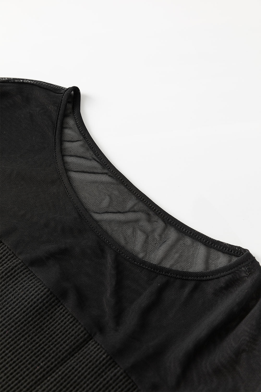 Zwarte blouse met patchwork en lantaarnmouwen met pailletten