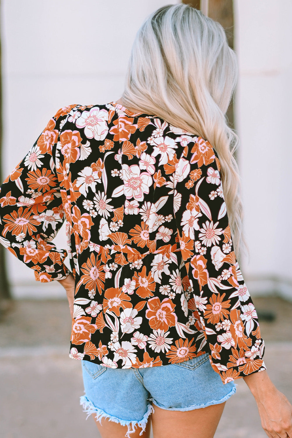 Bruine babydollblouse met 3/4 mouwen en bloemenprint
