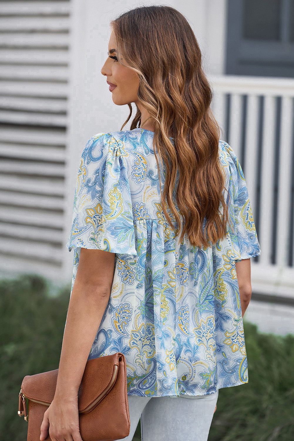 Hemelsblauwe losse blouse met paisleyprint en wijde mouwen