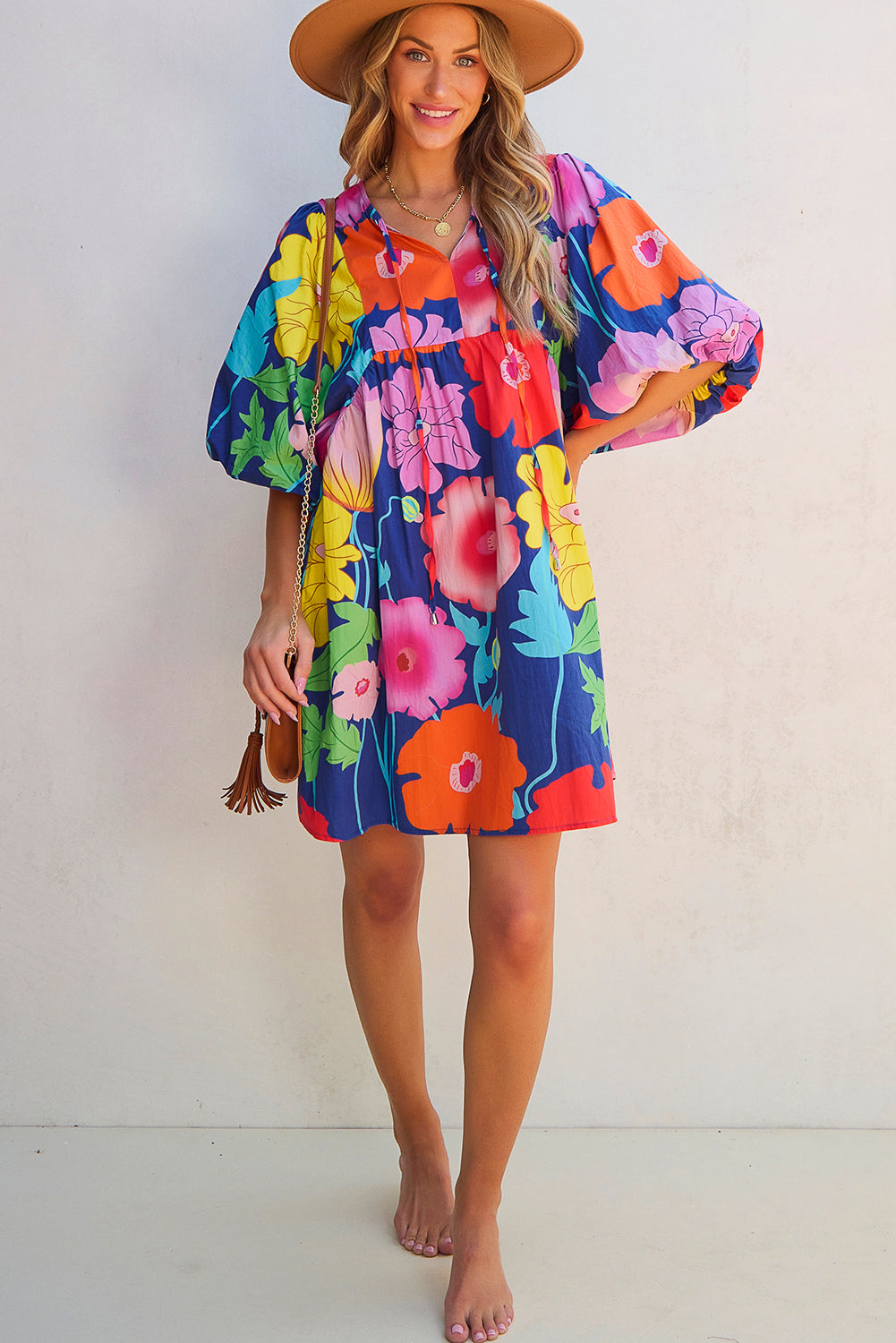 Donkerblauwe bloemenprint split nek babydoll jurk