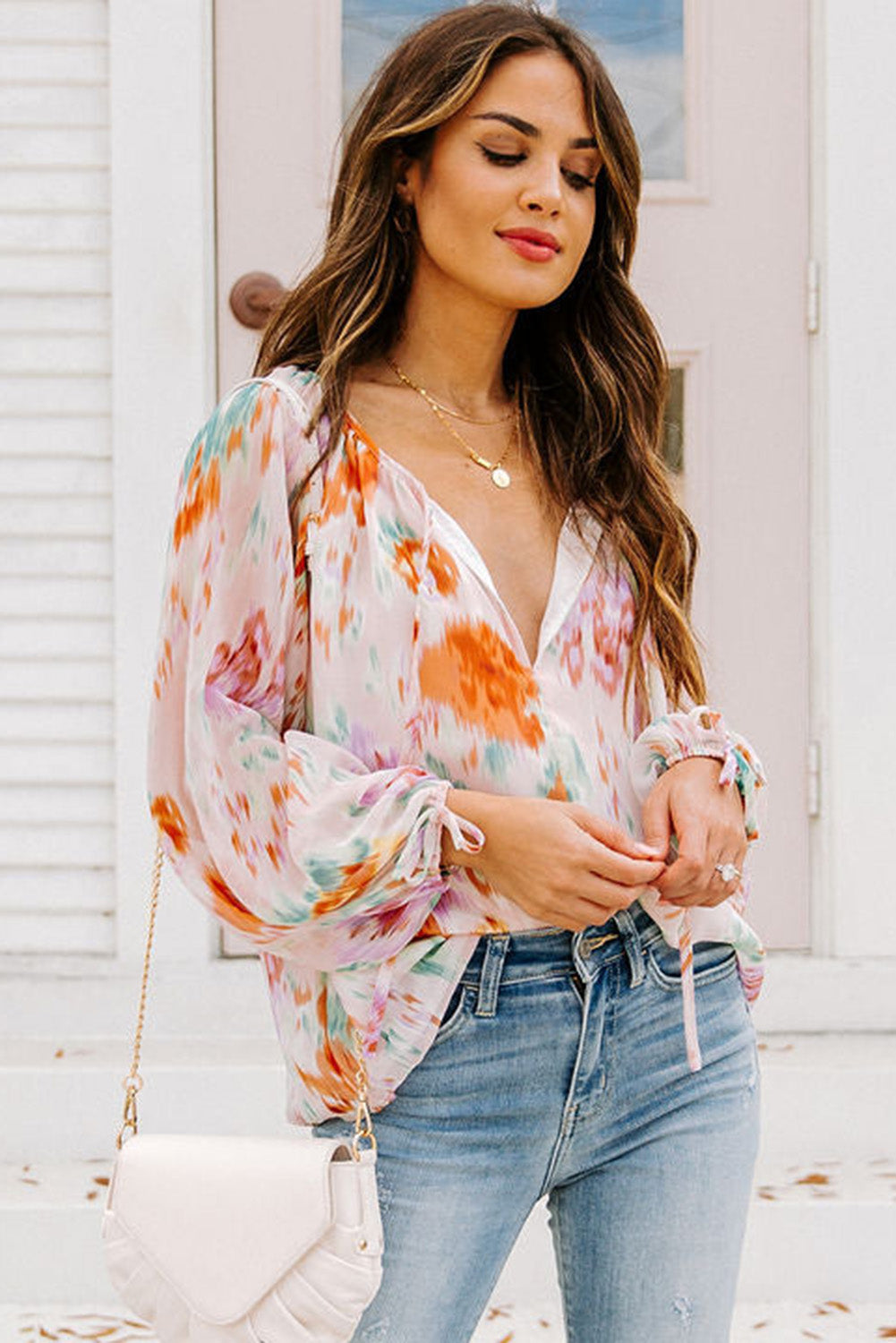 Blouse met veelkleurige abstracte print en splithals en pofmouwen