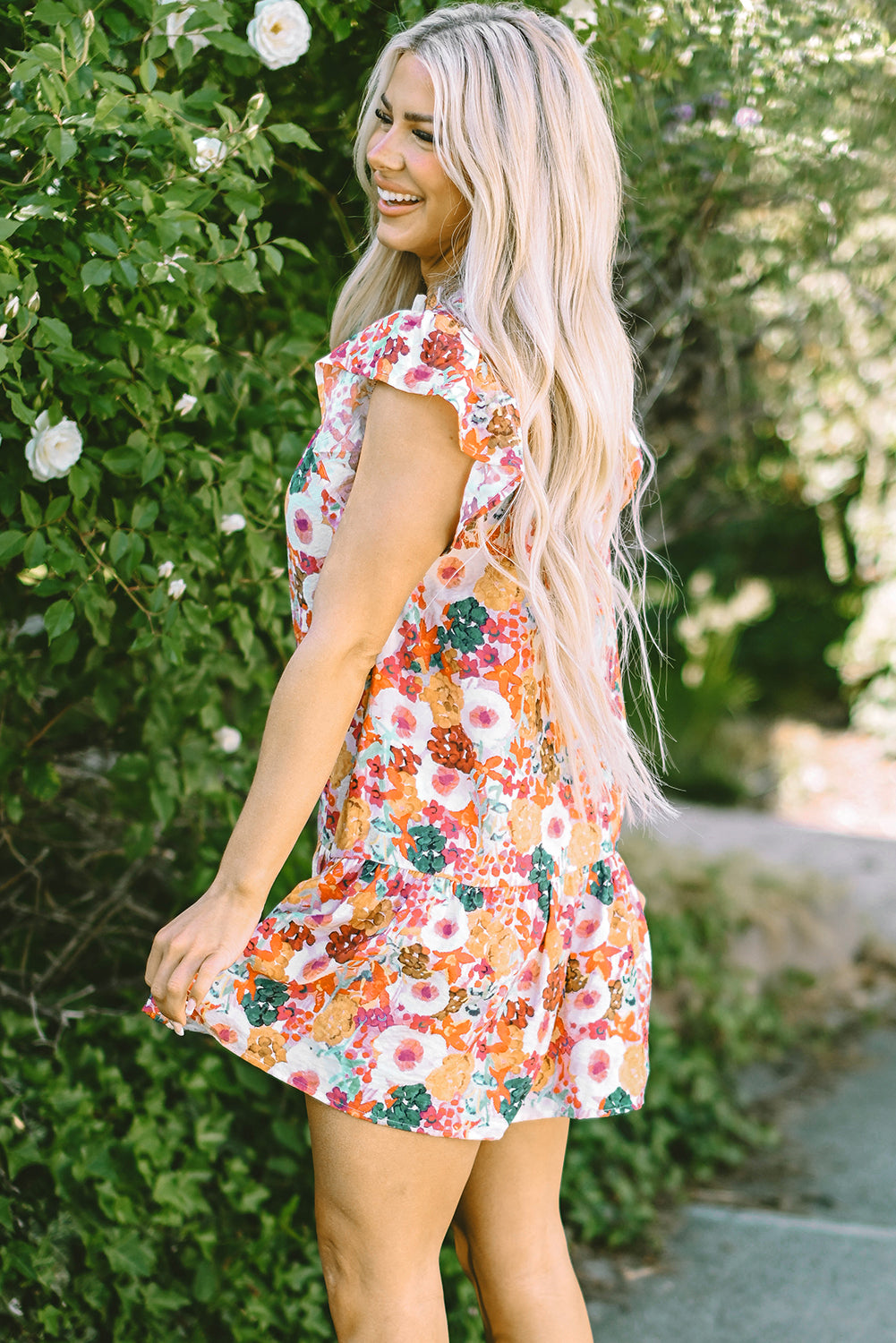 Paarse bloemenprint jurk met splitnek en fladdermouwen