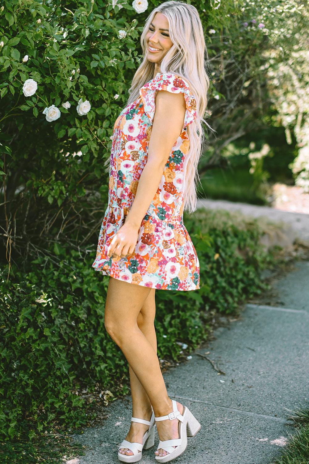 Paarse bloemenprint jurk met splitnek en fladdermouwen