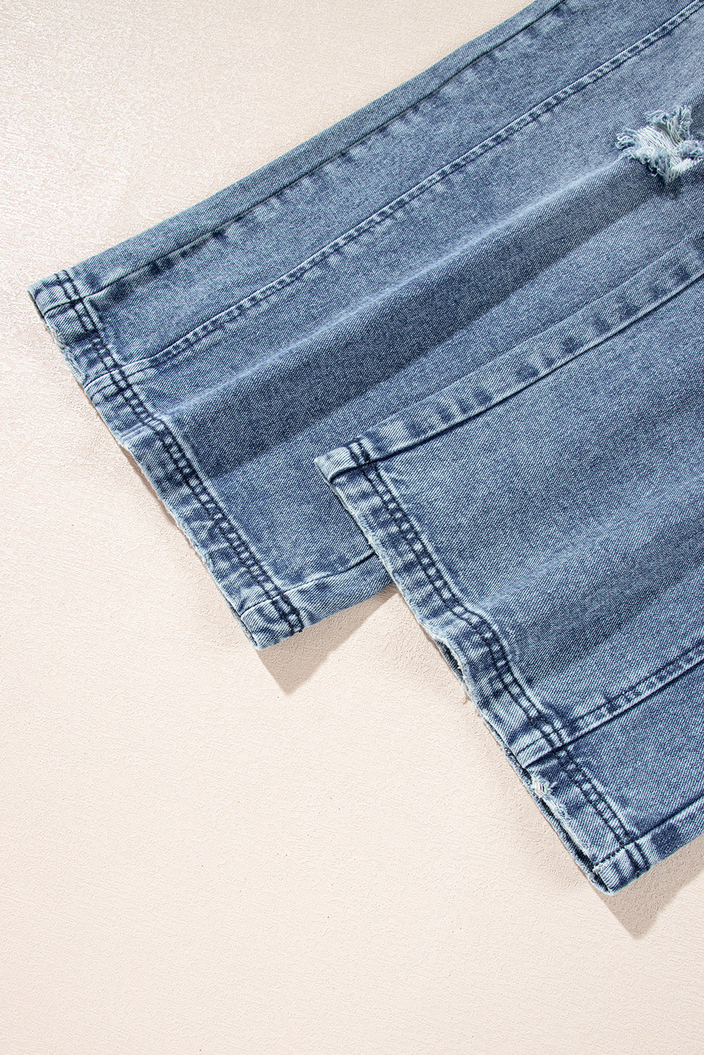 Steenblauwe bedroefde slabbetje zak wijd been denim in het algemeen