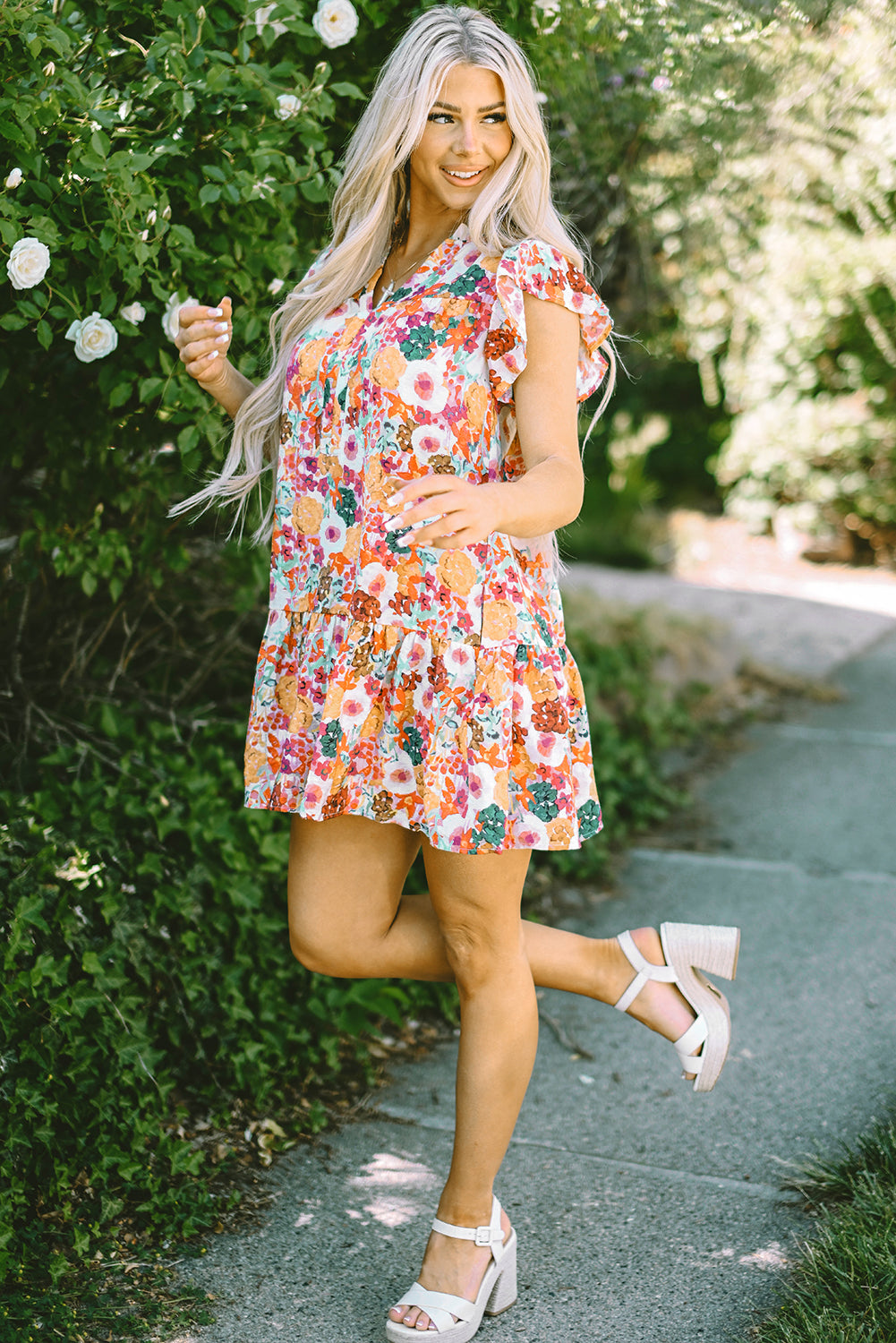 Paarse bloemenprint jurk met splitnek en fladdermouwen