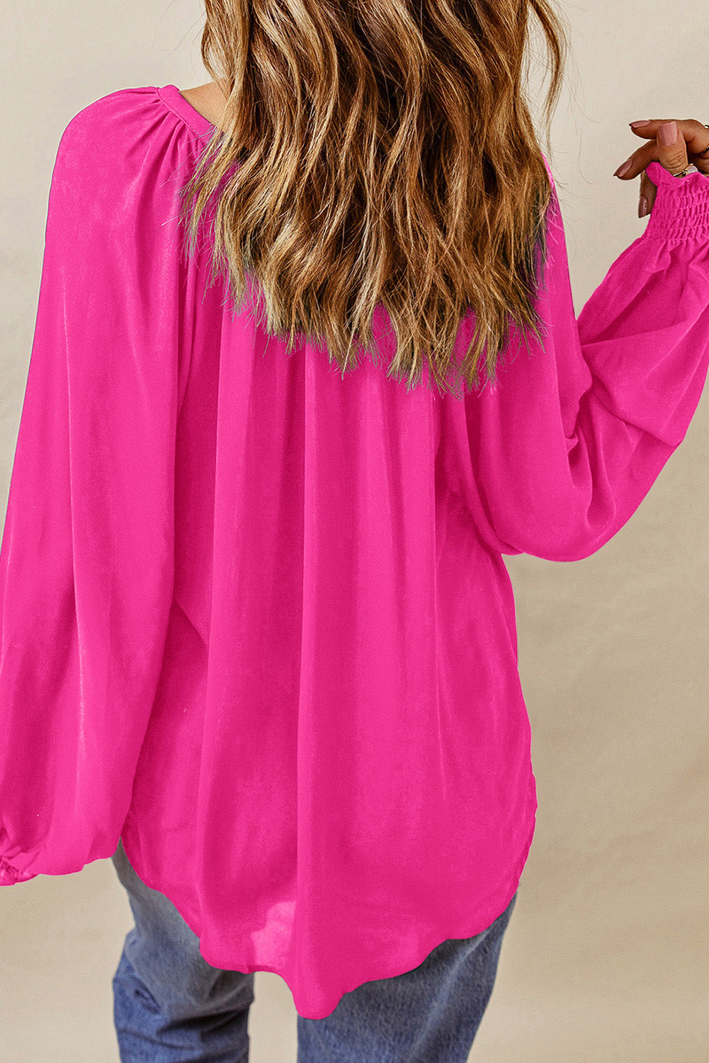Roze geplooide blouse met V-hals en gezwollen mouwen
