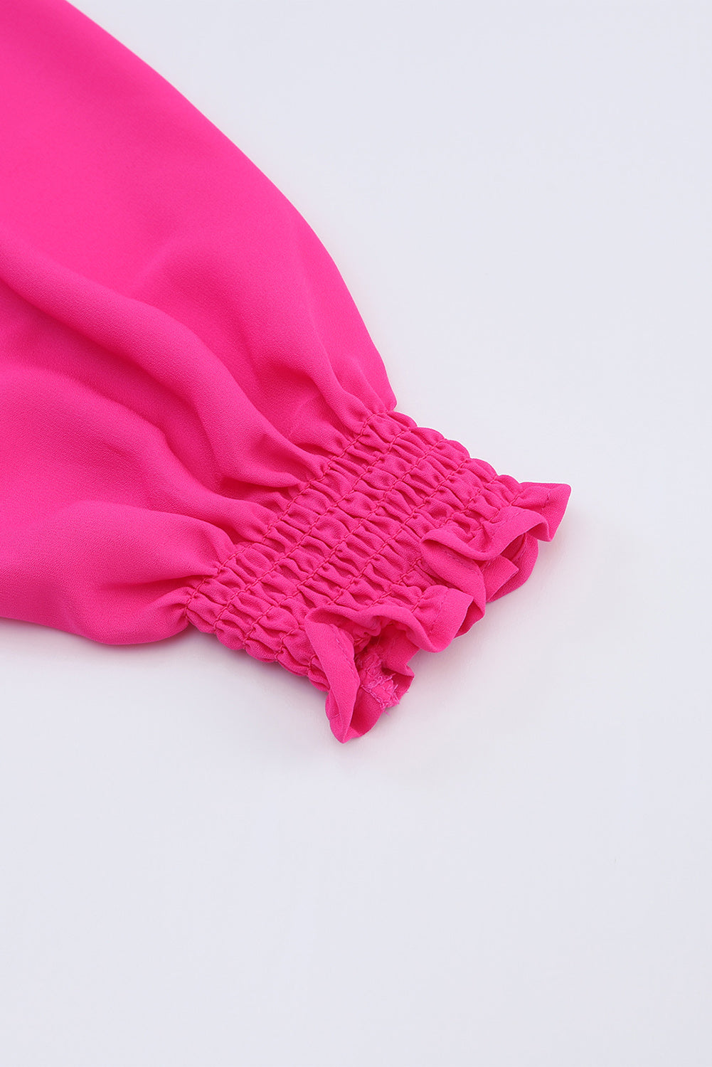 Roze geplooide blouse met V-hals en gezwollen mouwen