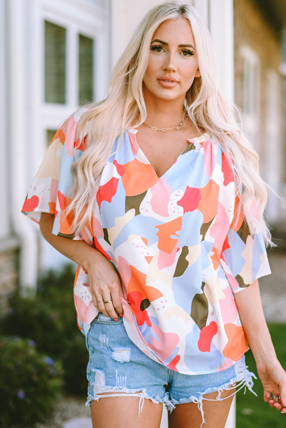 Blouse met veelkleurige bloemenprint, V-hals en halve mouw