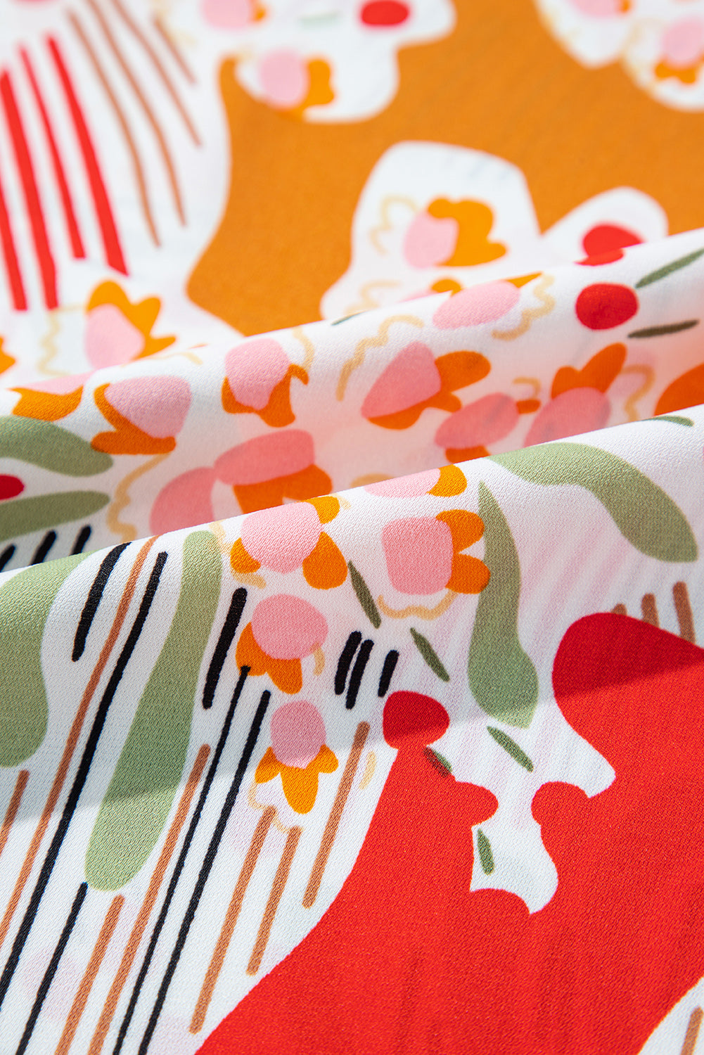 Oranje bedrukte blouse met V-hals en pofmouwen