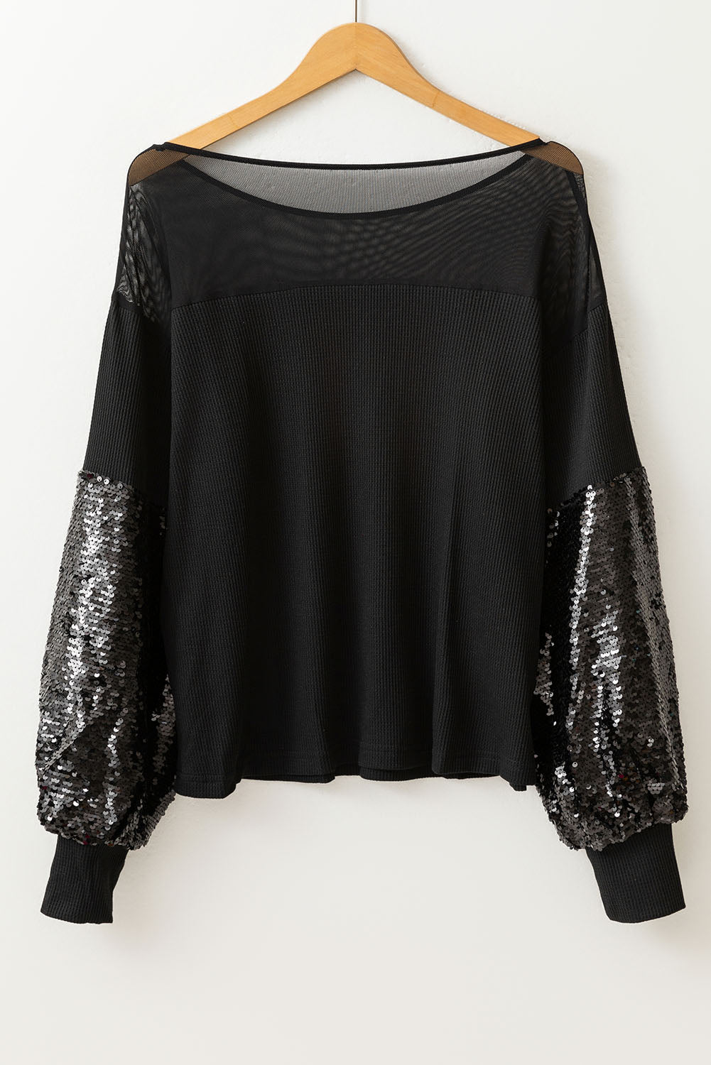 Zwarte blouse met patchwork en lantaarnmouwen met pailletten
