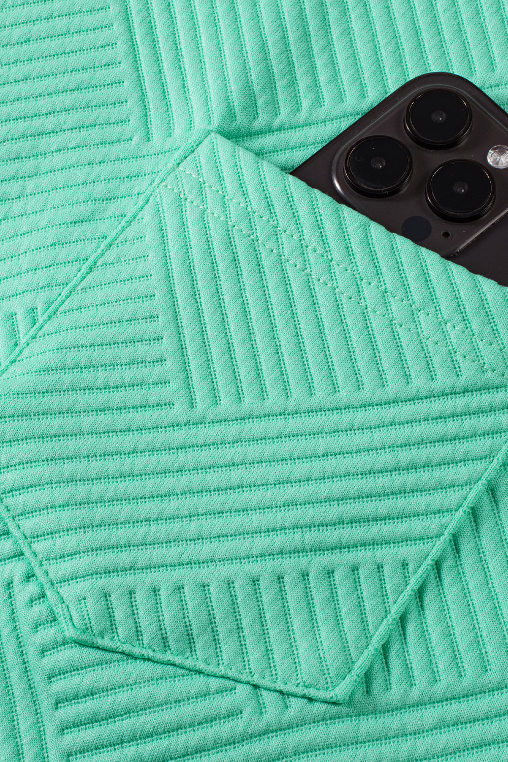 Mintgroene T-shirtjurk met getextureerde kapmouw